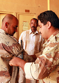 Soldier demonstrating how to apply tourniquet.