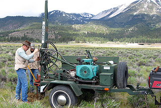 UNR scientists drilling test wells.