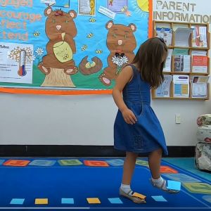 A girl crossing her feet.