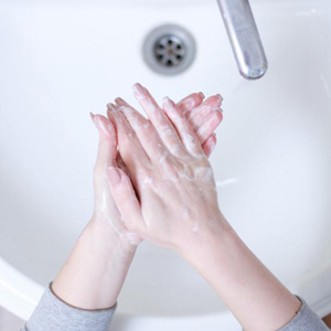 hands being washed in a sink