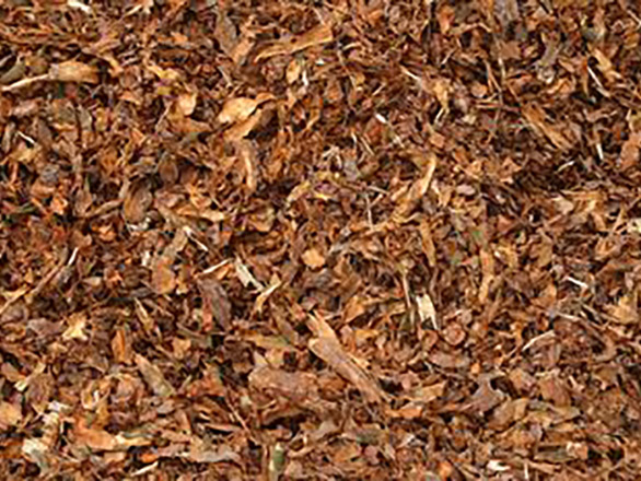 Shredded wood or bark can be a useful organic mulch.
