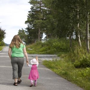 Mom and daughter going for a walk.