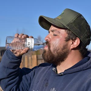 man hydrating with water