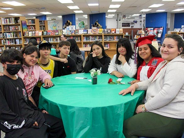 students sitting around library table