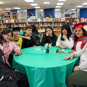 students sitting around library table