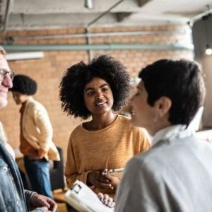 Three people talking with eachother.