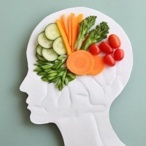 A brain made of various healthy foods to depict brain health.