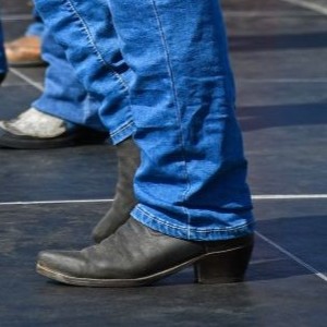 A person wearing cowboy boots.