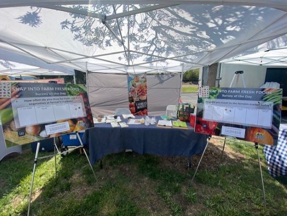 SNAP nutrition education booth at the farmers market
