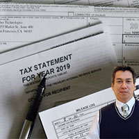 Several tax forms and Juan Salas
