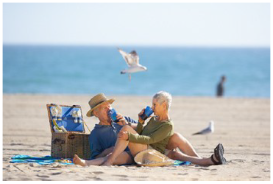 Old couple relaxing at beach