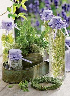 herb vinegar in a decorative bottle with lavender springs in the background