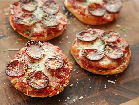 English muffin pizzas with pepperoni and cheese. 