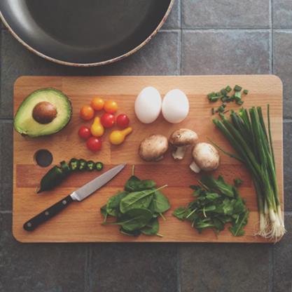 Various food ingredients on a chopping board.