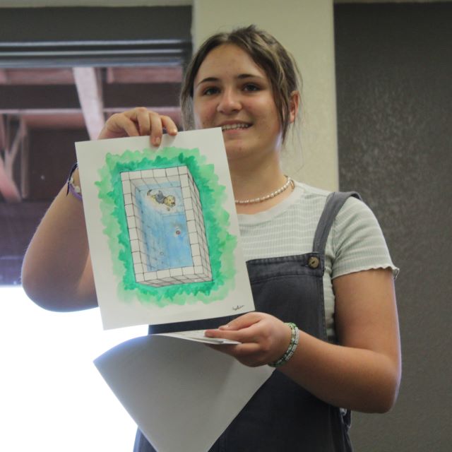 Girl holding a paiting