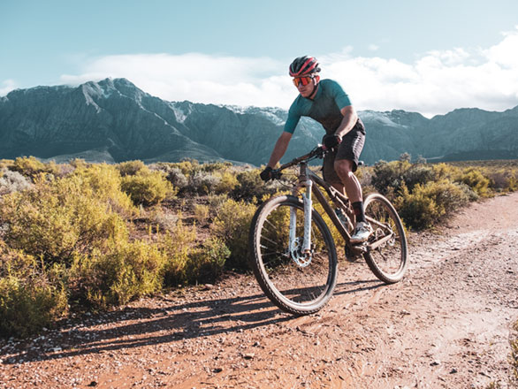 mountain biker on gravel road