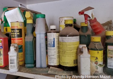 A shelf full of chemical pesticides.