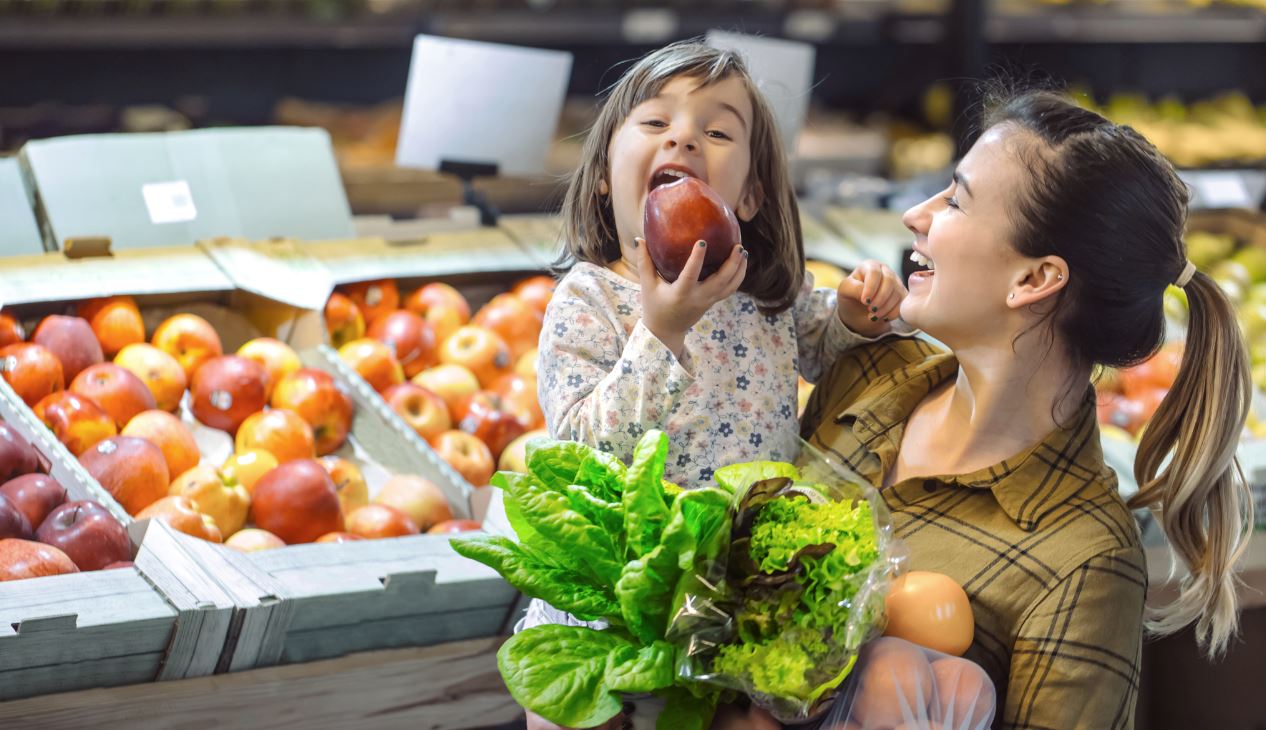 Mother and daughter and grocery store