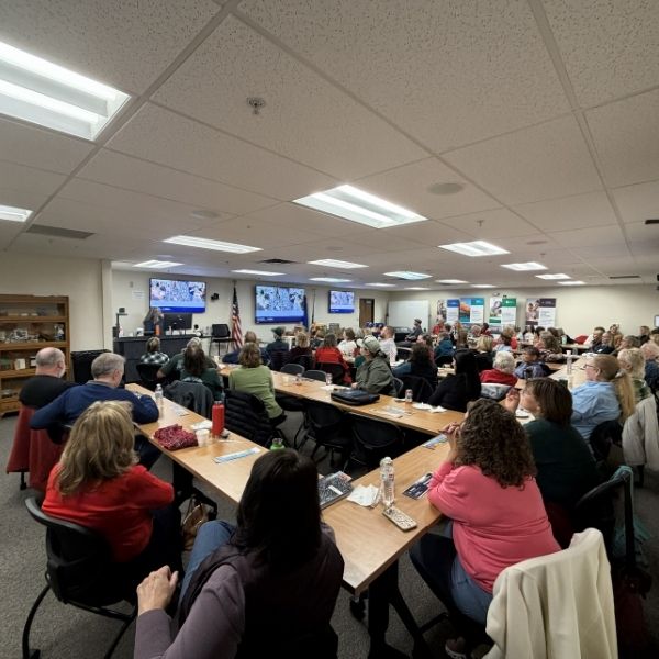 Room of volunteers sitting at tables