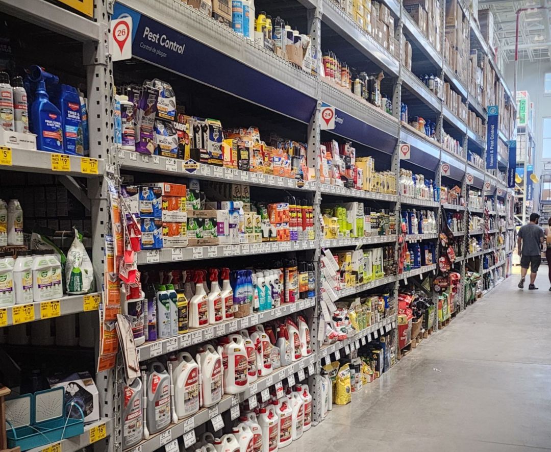 View of a pesticide aisle at a big store, lots of options are available with many different items on the shelf