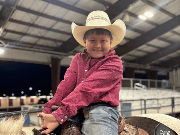 Image of Child at farm fest on a horse