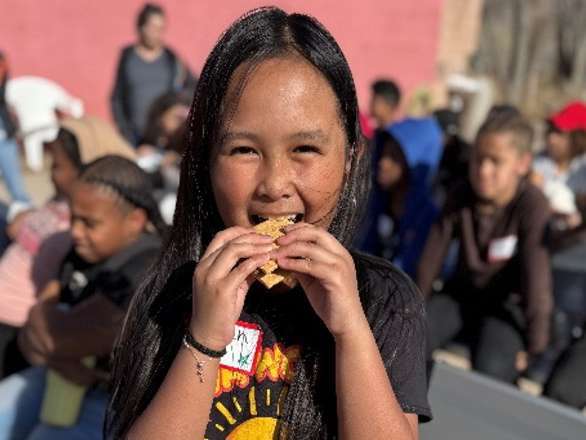 Youth eating a s'more