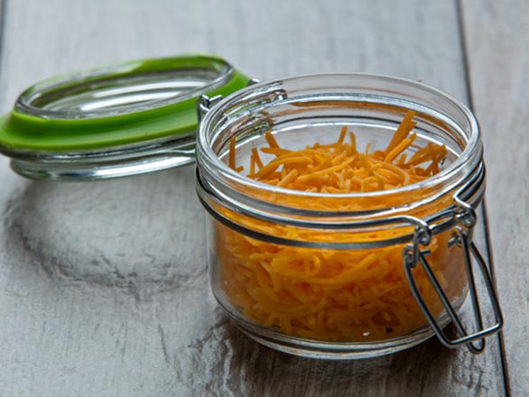 shedded cheese in a jar