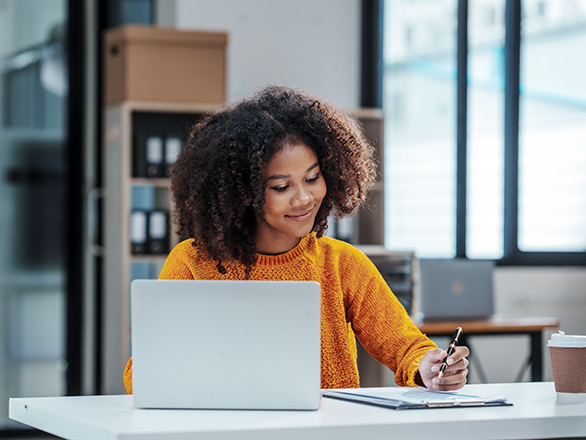 teenage girl working on computer
