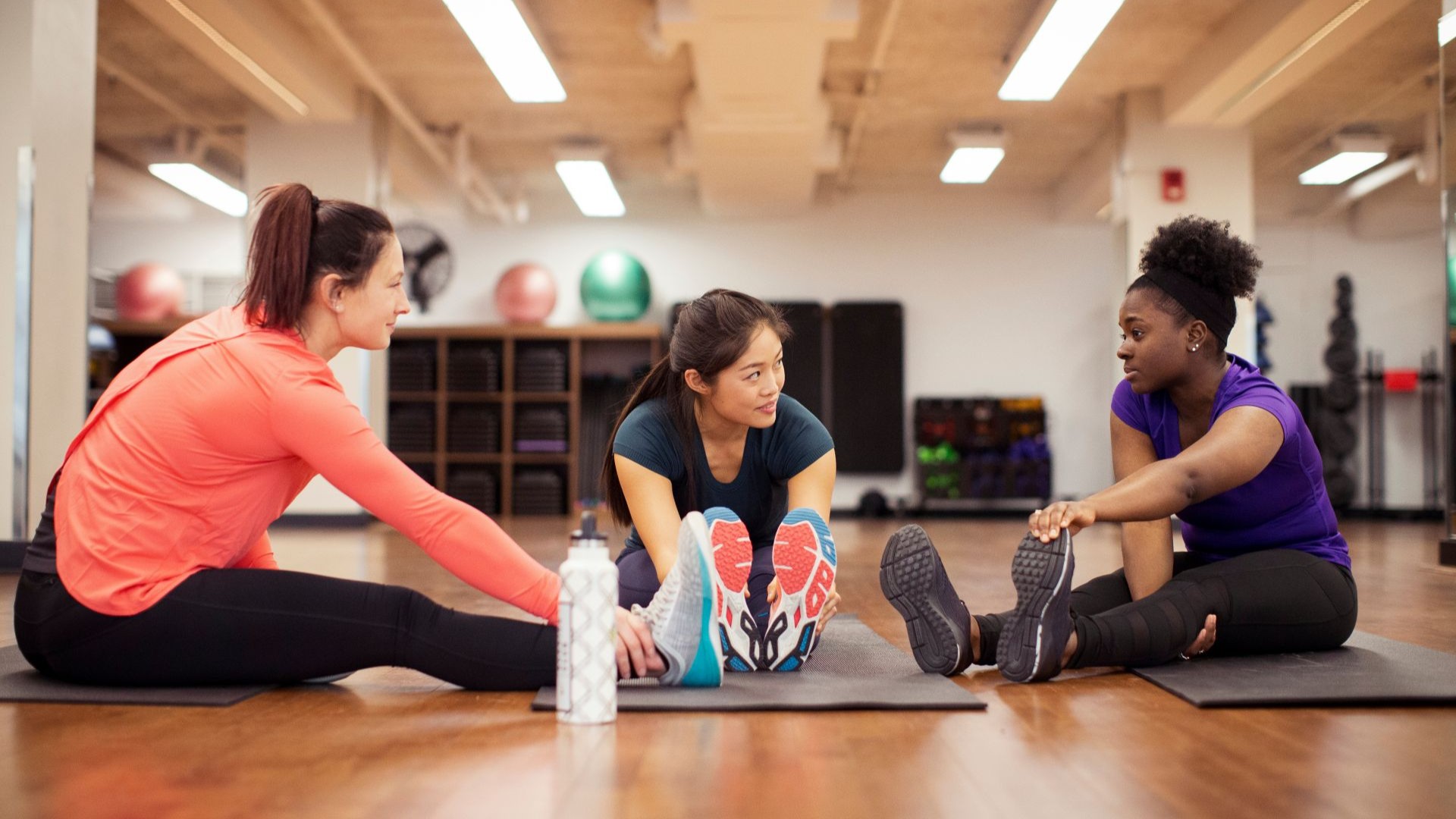 3 women stretching.