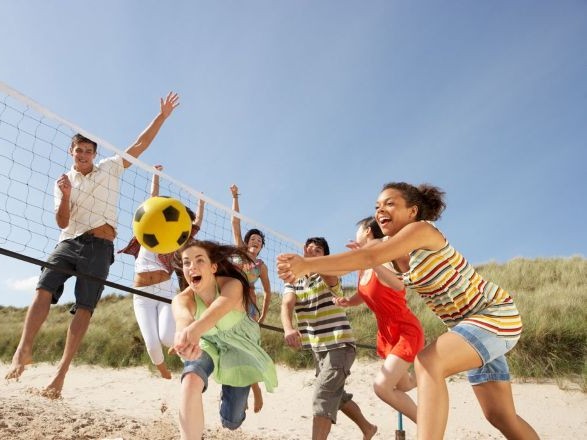group of people playing beach baketball