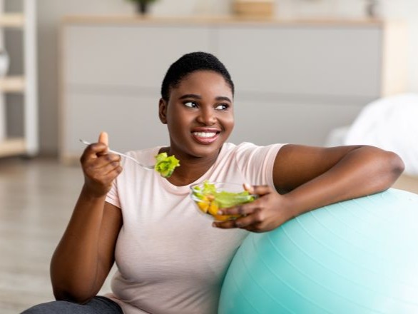 Woman eating salad