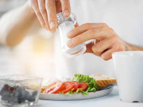 peson holding a salt shaker