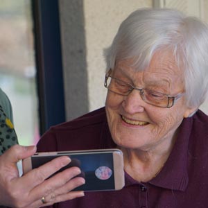 elderly women looking at smart phone.