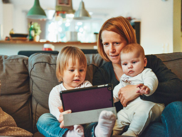 mother with babies on computer