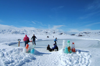 People enjoying the ice covered lake at Wild Horse State Park