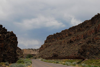 Road leading to Echo Canyon with a walking bridge on left