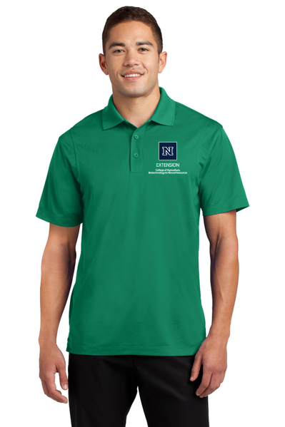 A man wearing a kelly green polo embroidered with the College's Extension logo.