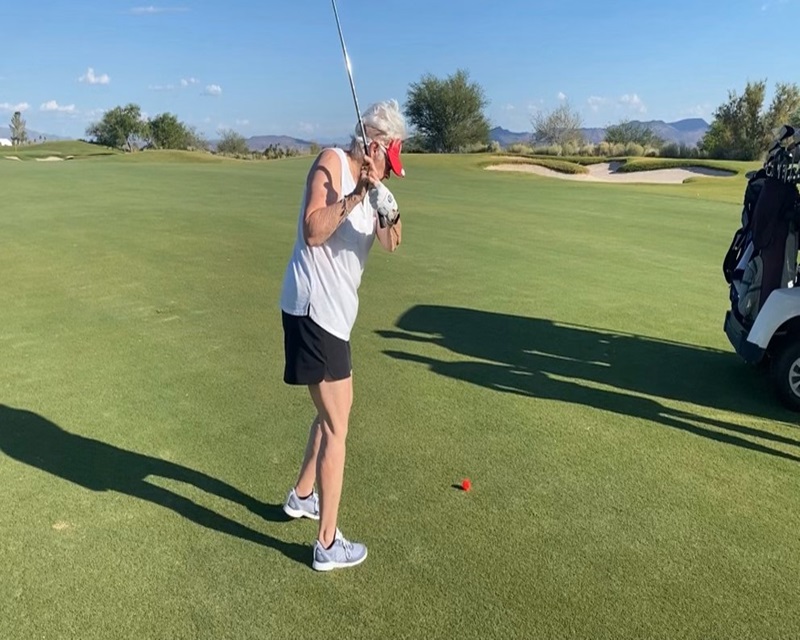 S. Lindsay, mom of A. Lindsay, golfing.