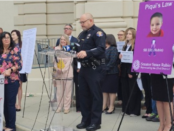 Pasadena Police Deputy Chief Art Chute addresses supporters of Piqui's Law on the steps of Pasadena City Hall.