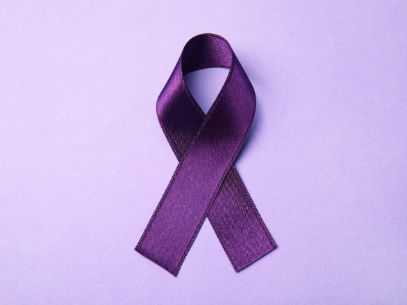 A purple ribbon on a light purple background.
