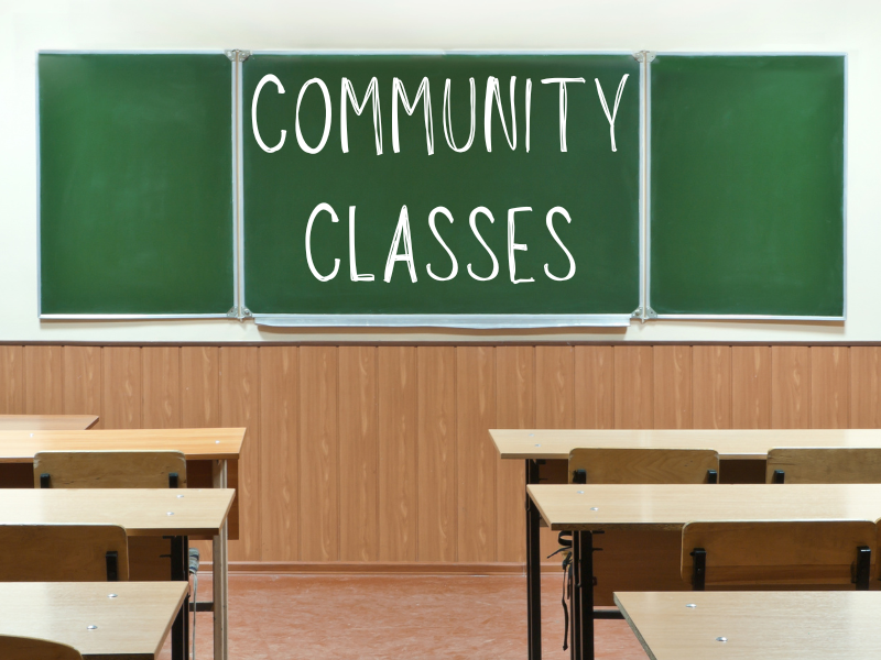 Classroom with "Community Classes" on chalkboard